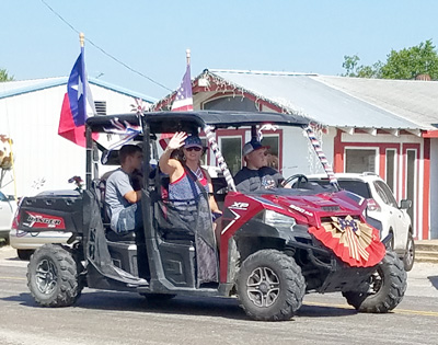 parade streetman mower lawn 4th annual july side waving riders patriotic flags