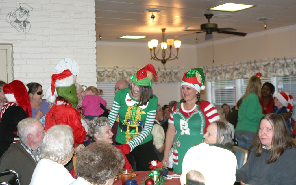 Elves Spread Cheer As Downtown Hosts Sip, Snack, Shop Event in 2018