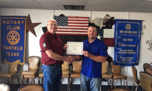 Tyus Joins Rotarian Tradition