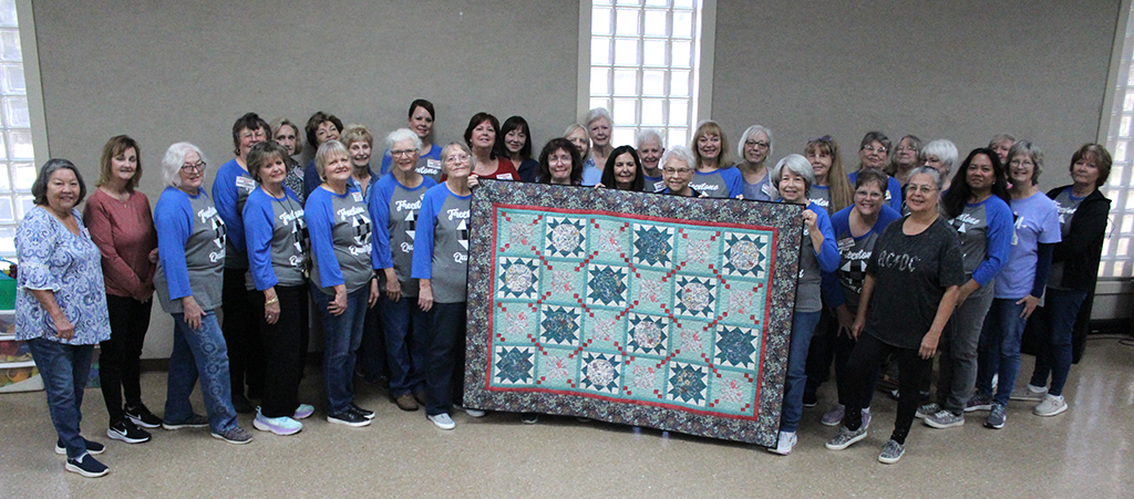 Freestone Quilf Guild Donates Charity Quilt to Raise Funds for The Train of Hope Project