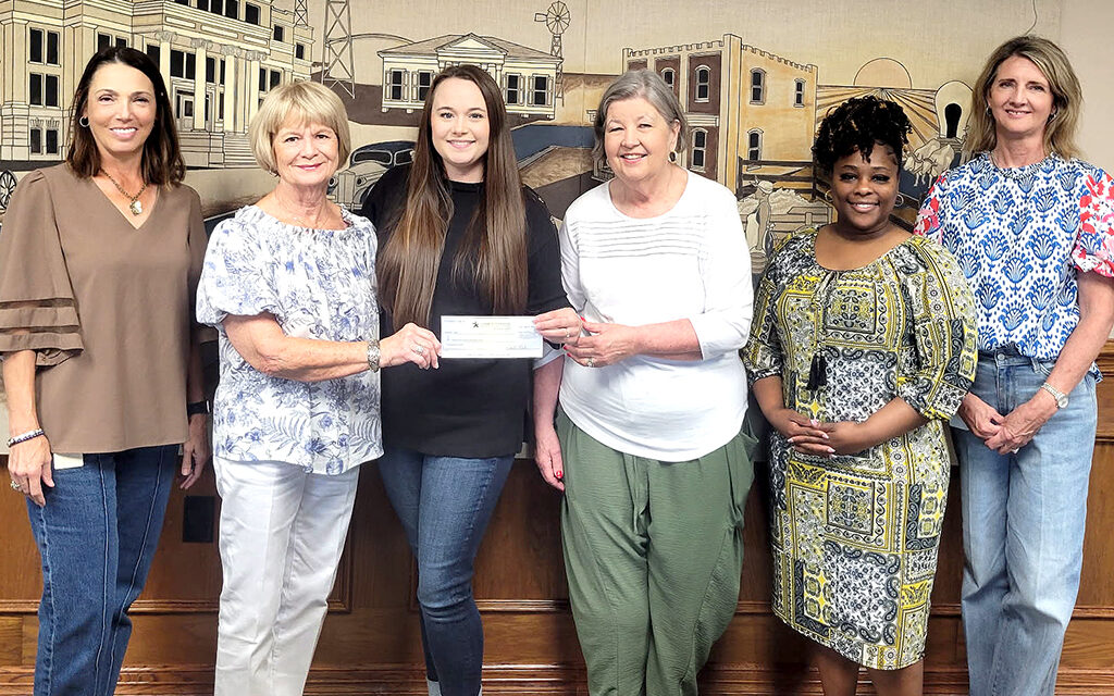Sponsors Begin for FCSG Fall Style Show with a Check from Community National Bank & Trust